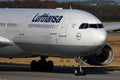 Lufthansa plane landing on runway, close-up view cockpit