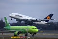 Lufthansa A380 plane taking off, S7 plane taxiing