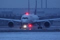 Lufthansa A350 plane taxiing on Munich Airport, MUC, snow Royalty Free Stock Photo