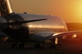 Lufthansa plane taxiing on taxiway, close-up view at sunset