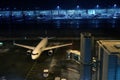 Lufthansa plane at terminal gate, night view, Munich