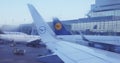Lufthansa wings in airport seen through frosted window