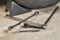 Lug wrench, tire iron, pressure gauge and a wheel chock