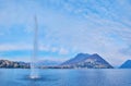 Lugano Lake, fountain and Monte Bre, Lugano, Switzerland Royalty Free Stock Photo