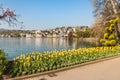 Lugano park Ciani with colorful tulips in bloom with view of lake Lugano and city center, Lugano, Switzerland Royalty Free Stock Photo