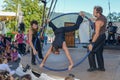 Acrobat on a hula hoop does tricks at Buskers Festival