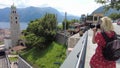 photographer woman by Lugano cityscape