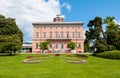 View of Villa Ciani with colorful tulips foreground in the public city park of Lugano.