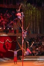LUGANSK ,UKRAINE - APRIL 9, 2016: several acrobats in a circus performance on the pole Royalty Free Stock Photo