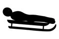 Luge. Side view. Silhouette. The athlete goes down the track on a sled lying on his back. The athlete competes in the downhill.