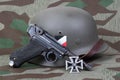 Luger P08 Parabellum handgun, helm and medal Iron Cross Royalty Free Stock Photo