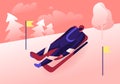 Luger in Sportswear and Helmet Lying on Sleigh Face Up Going Downhills with High Speed between Yellow Flags on Sticks