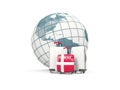 Luggage with flag of denmark. Three bags in front of globe