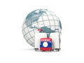 Luggage with flag of laos. Three bags in front of globe