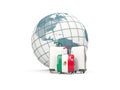 Luggage with flag of mexico. Three bags in front of globe