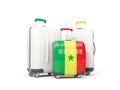 Luggage with flag of senegal. Three bags isolated on white