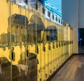 Luggage stored in transparent glass boxes in airport lounge