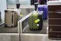 Luggage on weight at check-in counter at airport Royalty Free Stock Photo