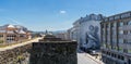 Panorama view of the Roman city walls of Lugo and downtown district with a large mural of a Roman soldier on a building