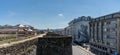 Panorama view of the Roman city walls of Lugo and downtown district with a large mural of a Roman soldier on a building