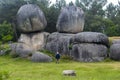 A man observes some huge granite rocks