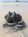 Lugworm is excreted into the pile of sand.