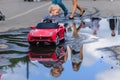 LUH, RUSSIA - AUGUST 27, 2016: little boy rides an electric mini car