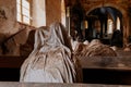 Lukova, Czech Republic, 29 October 2023: Abandoned catholic church of St. George or Jiri, Ghosts line pews, statues by Jakub