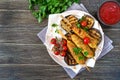 Lula kebab with grilled eggplant on pita bread. Dietary chicken kebabs on a skewer with vegetables. The top view Royalty Free Stock Photo