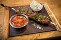 Lula kebab with tomato salsa Royalty Free Stock Photo