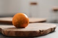 Lulo fruit on olive wood board on kitchen countertop Royalty Free Stock Photo