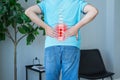 Lumbar intervertebral spine hernia, man with back pain at home, spinal disc disease