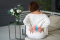 Lumbar intervertebral spine hernia, woman with back pain at home, spinal disc disease