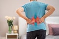 Lumbar spine hernia, man with back pain at home, compression injury of the intervertebral disc in the lower back