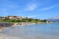 Locals and tourists enjoying a beautiful summer day along the sandy beaches of Lumbarda Beach on Korcula Island, Croatia Royalty Free Stock Photo