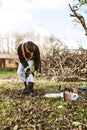 Lumberjack putting on a harness going to prune a tree. Royalty Free Stock Photo