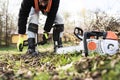 Lumberjack putting on a harness going to prune a tree. Royalty Free Stock Photo