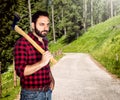 Lumberjack among the trees. Royalty Free Stock Photo