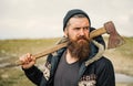 Lumberjack in the woods with an ax.