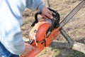 Lumberjack working with chainsaw, cutting wood Royalty Free Stock Photo