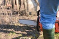 Lumberjack working with chainsaw, cutting wood Royalty Free Stock Photo