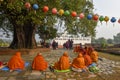 Monks praying at Maya Devi temple birth place of Buddha in Lumbini on Nepal