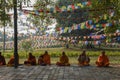 Monks praying at Maya Devi temple birth place of Buddha in Lumbini on Nepal