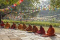 Monks praying at Maya Devi temple birth place of Buddha in Lumbini on Nepal