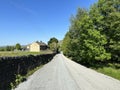 Lumbutts Road, with trees, and farms, near the Stoodley Monument in, Todmorden, UK