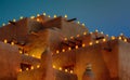 Luminaria on adobe building Royalty Free Stock Photo