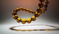 Luminous Amber Beads in a Floating Circle with Dramatic Shadow Royalty Free Stock Photo