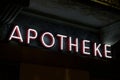 Luminous Apotheke neon inscription hanging in Switzerland Royalty Free Stock Photo