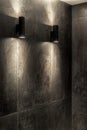 Luminous black lamps on tiled wall indoors Royalty Free Stock Photo