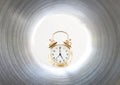 luminous clock at the end of the tunnel Royalty Free Stock Photo